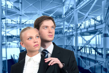 young business couple on industrial interior collageの写真素材