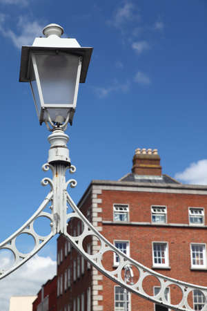 white lantern of Ha'penny Bridge over River Liffey in Dublin, Irelandのeditorial素材