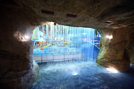 MOSCOW - MARCH 21: Waterfall  in  artificial cave in Kva Kva park  on March 21, 2010 in Moscow , Russia. Having opened doors on November 5th, 2006, it has quickly won hearts of visitors.のeditorial素材