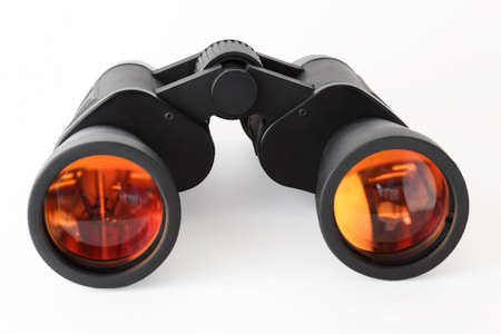 Optical equipment for searching on white background; orange reflection in lensの写真素材