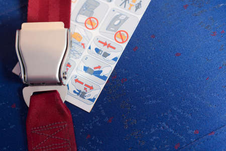 Locked seatbelt and instruction lay on the chair.の写真素材