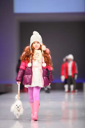 MOSCOW - FEBRUARY 22: Unidentified child model wear fashions from Snowimage and walk the catwalk in the Collection Premiere Moscow, an international fashion fair for Eastern Europe, on February 22, 2011 in Moscow, Russia.のeditorial素材