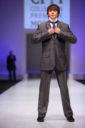 MOSCOW - FEBRUARY 22: Man wear gray suit from Slava Zaytzev walk the catwalk in the Collection Premiere Moscow, a leading fashion fair in Eastern European market, on February 22, 2011 in Moscow, Russia.のeditorial素材