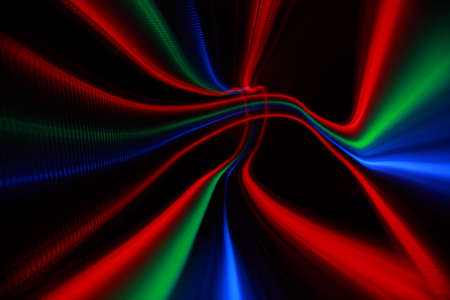 Abstract colorful lines on black background, bright red, green and blue freezelight paint 