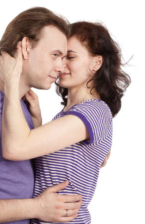 Closeup young couple in violet t-shirts embracing.の写真素材