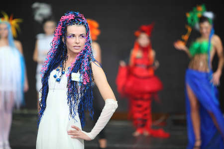 MOSCOW - OCTOBER 2: Model with braiding hairdo at III Braiding Russian Championship in Gostiny Dvor, on October 2, 2010 in Moscow, Russia. Main prize from organizer championship, company HAIRSHOP - designer diamond ring worth $10,000のeditorial素材