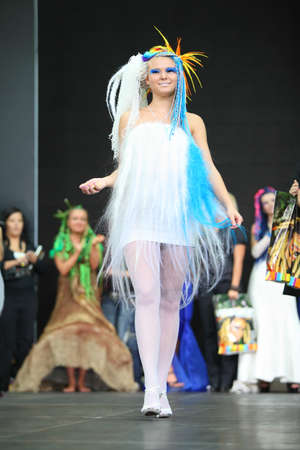 MOSCOW - OCTOBER 2: Smiling model with fanciful braiding hairdo at III Braiding Russian Championship in exhibition complex Gostiny Dvor, on October 2, 2010 in Moscow, Russia.のeditorial素材