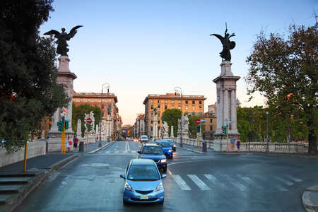 Cars go on Ponte Vittorio Emanuele II in Rome, Italy, beautiful sculpturesのeditorial素材