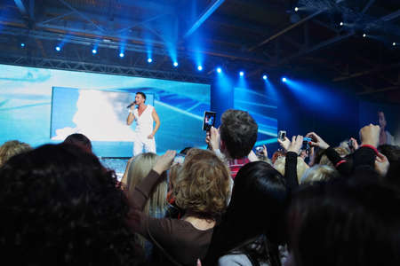 MOSCOW - OCTOBER 3: Sergey Lazarev sings and audience photographs him at Competition Wella Trend...