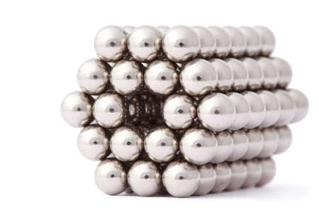 hexagon of metal segment assembled from spheres isolated on white の写真素材