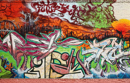 Abstract Interesting graffiti on vandalised wall; urban background photo
