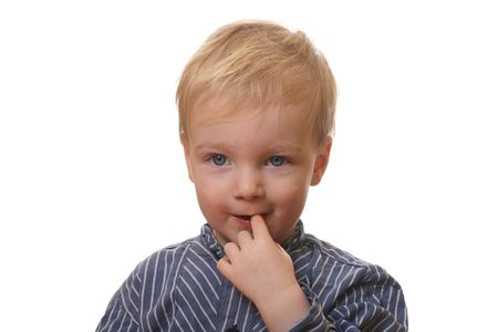 Young blond boy with white backgroundの写真素材
