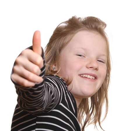Pretty young girl with thumbs upの写真素材