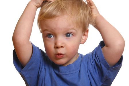 Surprised young boy with white backgroundの写真素材