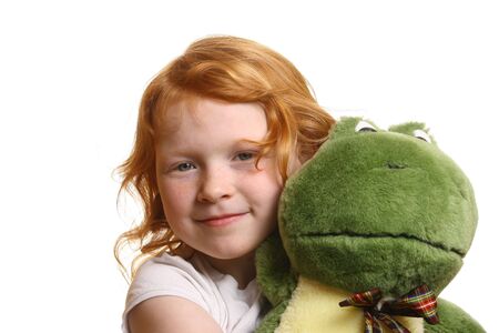 Red-haired girl with toy frog
の写真素材