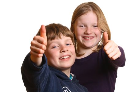 Happy young kids with thumbs upの写真素材