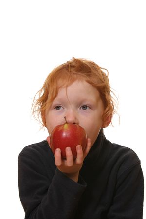 Happy and healthy girl eats an appleの写真素材