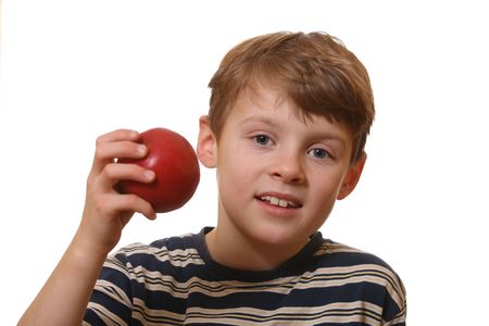 Happy and healthy boy shows an appleの写真素材