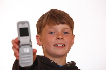Boy shows his new cell phoneの写真素材