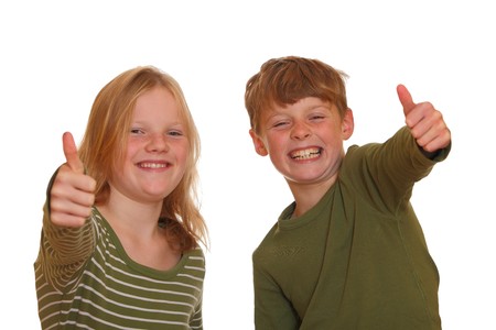 Laughing teenagers with thumbs-upの写真素材