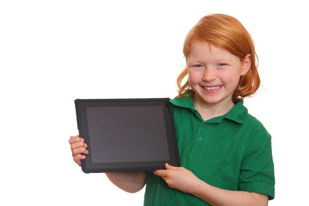 Smiling red haired girl presents her new tablet computerの写真素材