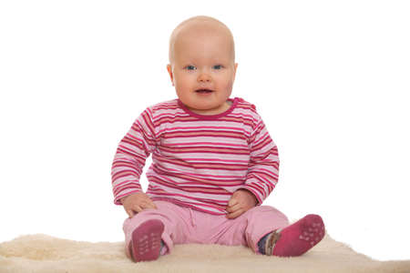 Happy baby sitting on the floorの写真素材