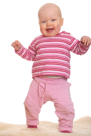 Baby girl's first stepsの写真素材