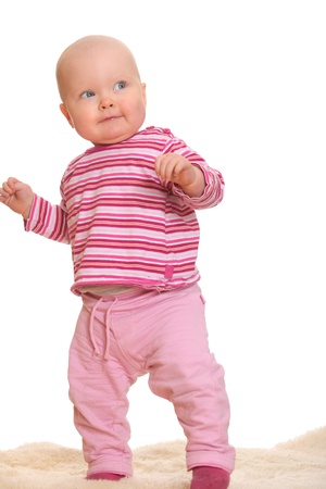 Baby girl's first stepsの写真素材