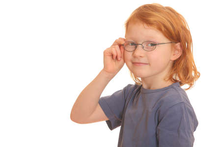 Portrait of a happy red haired girl wearing glassesの写真素材