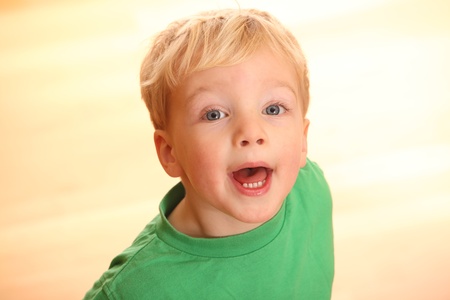 Portrait of a happy boy laughingの写真素材
