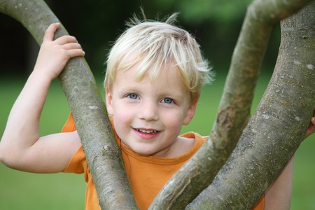 Portrait of a young boy in the gardenの写真素材