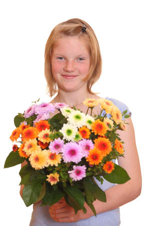 Portrait of a young girl holding a bunch of flowersの写真素材