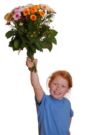 Portrait of a young girl holding a bunch of flowersの写真素材
