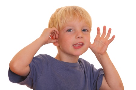Portrait of a funny young boy on white backgroundの写真素材