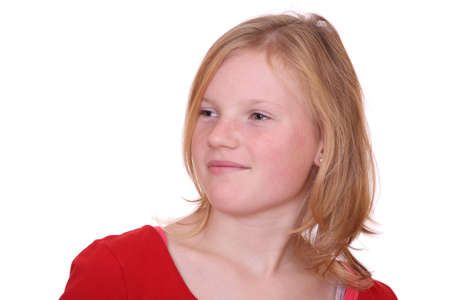 Portrait of a young blond girl on white backgroundの写真素材
