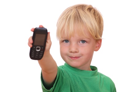 Portrait of a young boy presenting his new cell phoneの写真素材