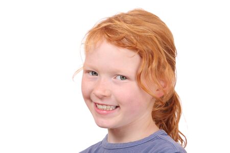 Portrait of a young red haired girl on white backgroundの写真素材