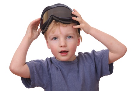 Portrait of a young boy wearing ski goggles isolated on white backgroundの写真素材
