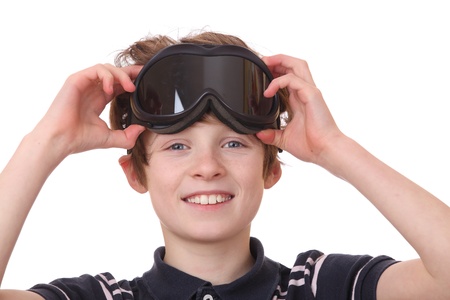 Portrait of a young boy wearing ski goggles isolated on white backgroundの写真素材