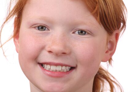 Portrait of a redhaired young girlの写真素材