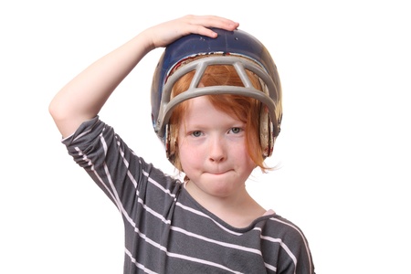 Girl with football helmet on white backgroundの写真素材