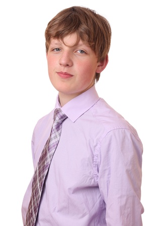 Portrait of a teenage boy in a business suit の写真素材