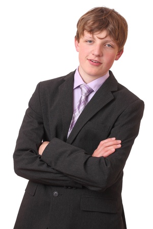 Portrait of a teenage boy in a business suit の写真素材
