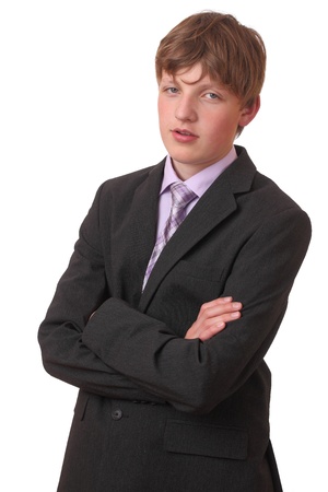 Portrait of a teenage boy in a business suit の写真素材