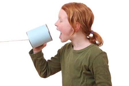 Young girl with a tin can telephoneの写真素材