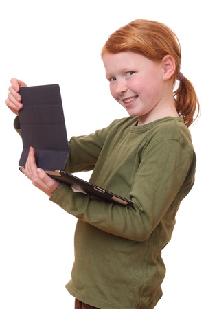 Happy young girl with tablet pc on white backgroundの写真素材