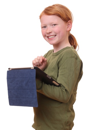 Happy young girl with tablet pc on white backgroundの写真素材