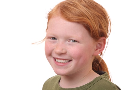 Portrait of a young redhaired girl on white backgroundの写真素材