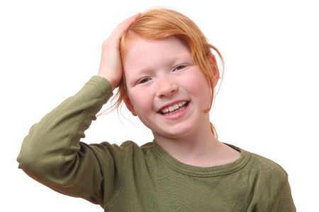 Young girl with a hand on her head on white backgroundの写真素材
