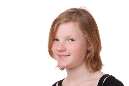 Portrait of a blond teenage girl on white backgroundの写真素材